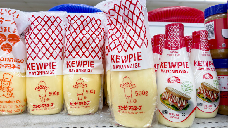 Bottles of kewpie mayonnaise on a grocery store shelf
