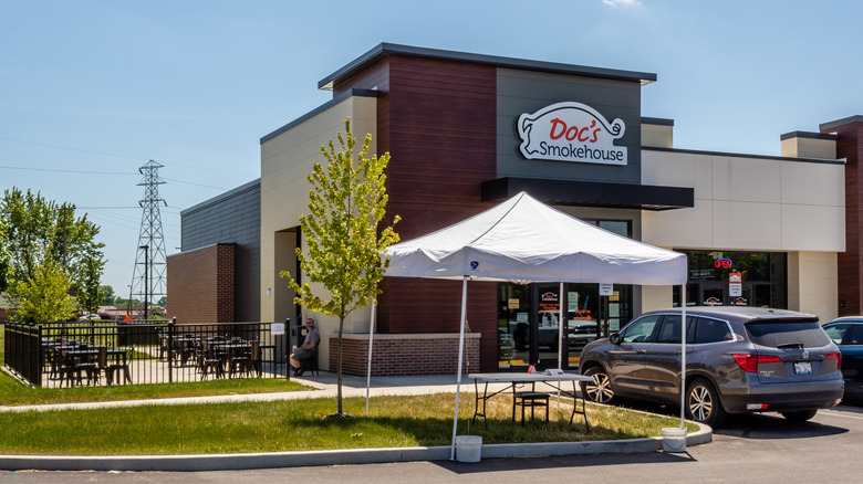 Exterior of Doc's smokehouse, on the corner of suburban strip mall.