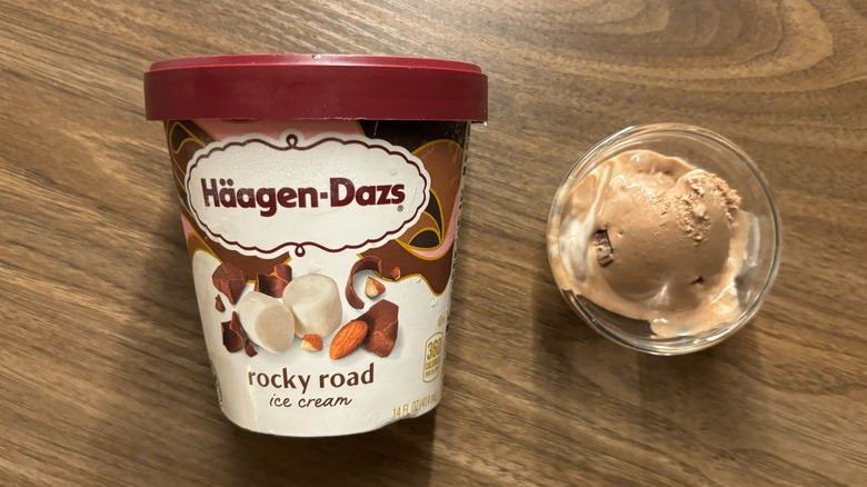 Häagen-Dazs Rocky Road Ice Cream carton next to ice cream in glass ramekin