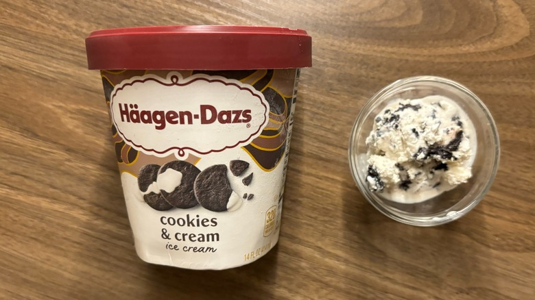 Häagen-Dazs Cookies & Cream Ice Cream carton next to ice cream in glass ramekin