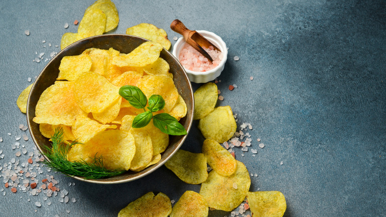 Crispy potato chips in a bowl