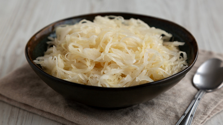 A bowl of sauerkraut on a table