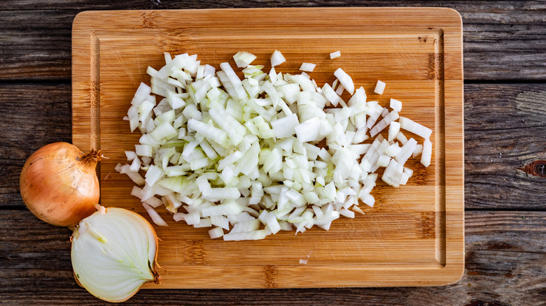 Diced white onions on a cutting board