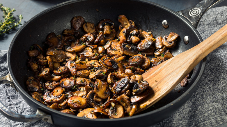 Mushrooms sauté in a pan