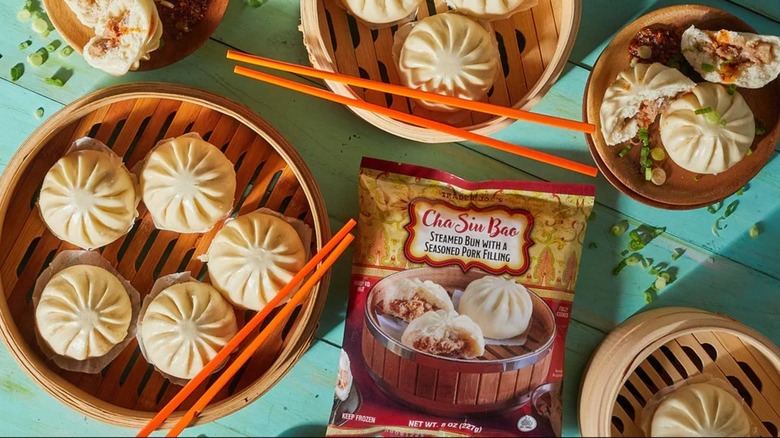 Trader Joe's cha siu bao in bamboo steamers with chopsticks resting on top