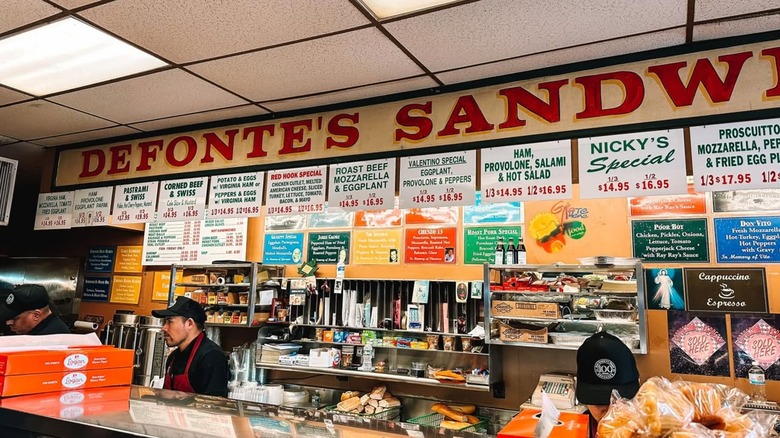 The menu above the sandwich bar at Defonte's