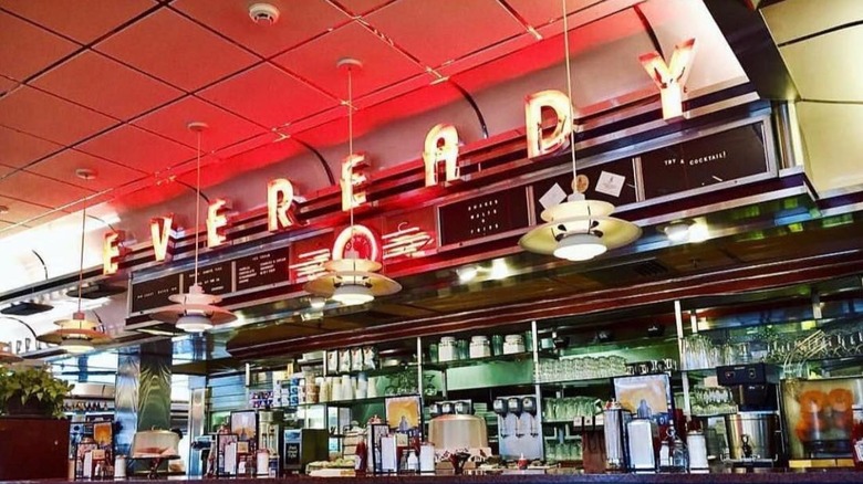 A neon Eveready sign above the bar of Eveready Diner