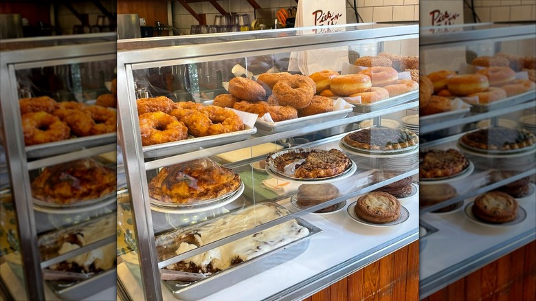 Donuts and pies in glass display case