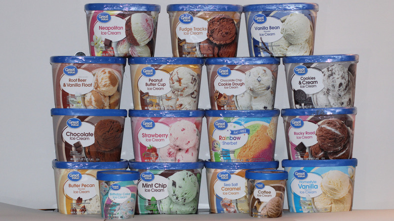 17 flavors of Walmart's Great Value Brand ice cream in containers stacked in pyramid, including flavors like mint chip, strawberry, and cookies and cream