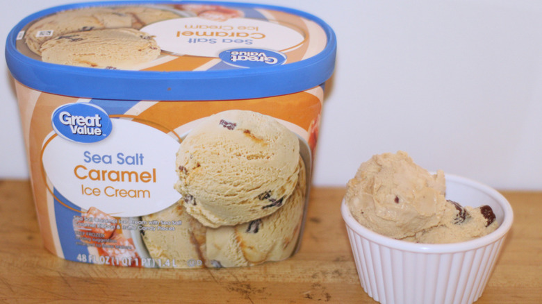 Great Value sea salt caramel ice cream container with a bowl of scooped ice cream beside it