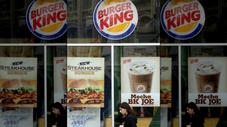 Burger King ads in window at store