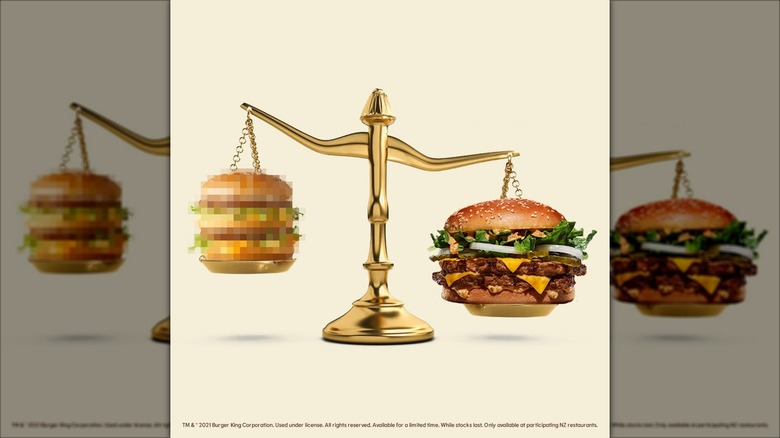 Burger King XL burger on a scale next to blurred out Big Mac