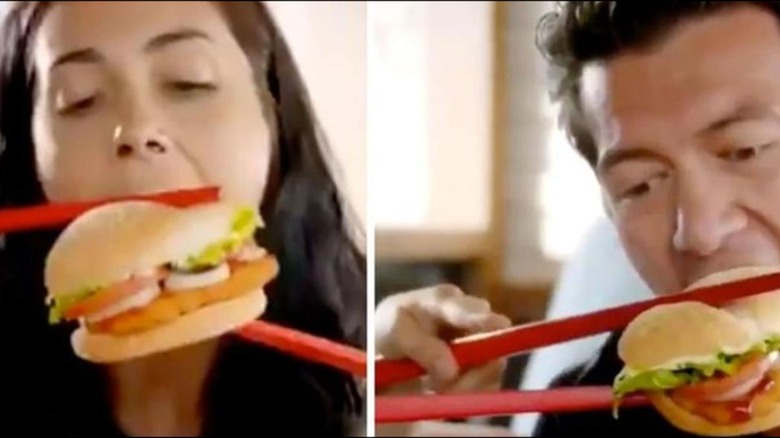 Actors in Burger King ad eating burger with chopsticks
