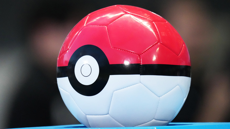 A Pokemon ball-themed soccer ball
