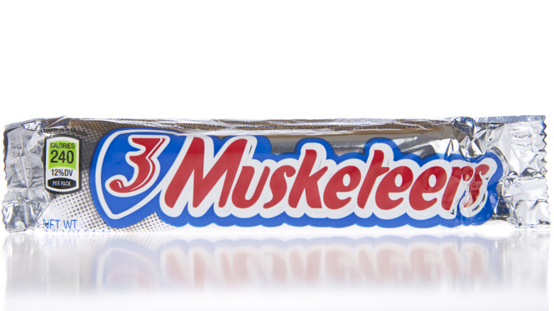 3 Musketeers chocolate candy bars on white background