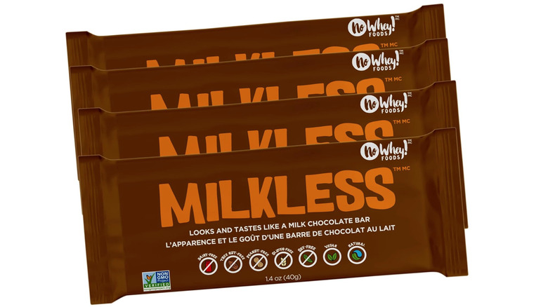 Four bars of No Whey Foods Milkless chocolate bars on a white background