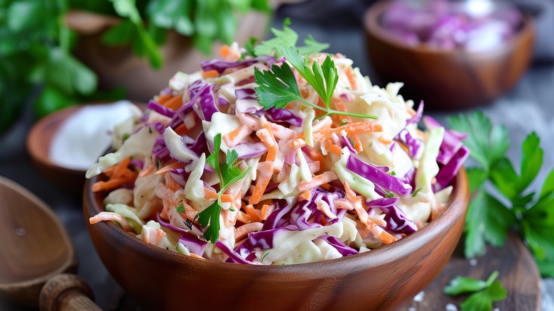 wooden bowl filled with colorful coleslaw