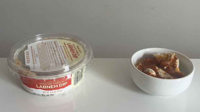A small container of Trader Joe's Roasted Tomato Labneh Dip