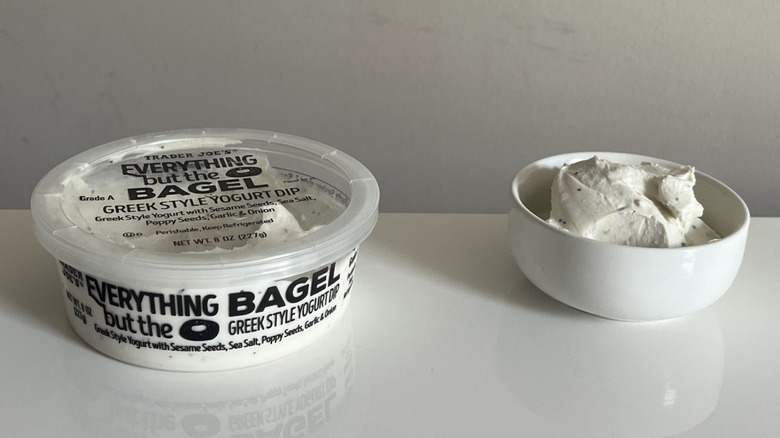 A tub and bowl of Trader Joe's Everything but the Bagel Greek Yogurt Dip