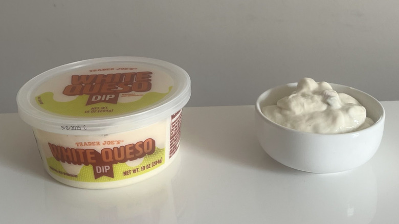A tub and bowl of Trader Joe's White Queso Dip