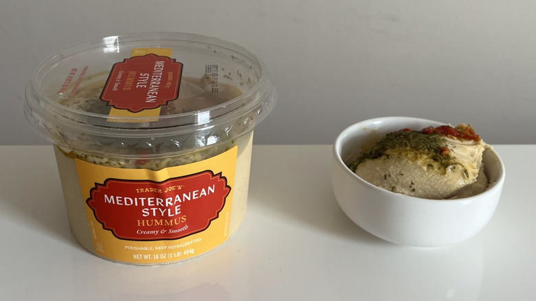 A tub of Trader Joe's Mediterranean Style Hummus