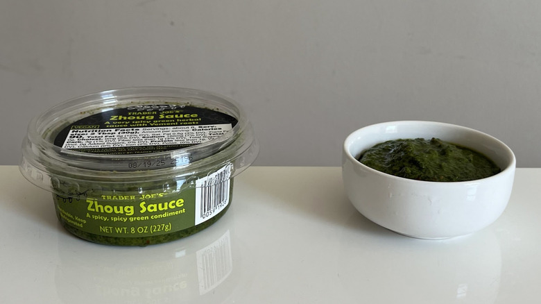 A container of Trade Joe's Zhoug Sauce