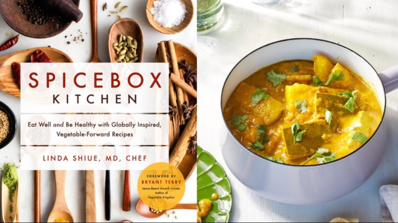 Image of the Spicebox Kitchen cookbook cover next to a pot of the Trinidadian curry mango