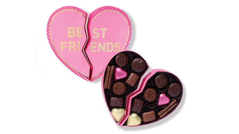 Besties Heart gift box containing assorted chocolate on a white background