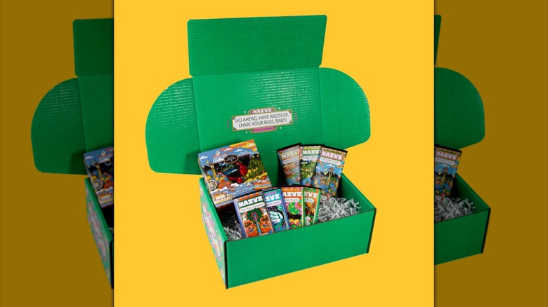 Taste The PNW Chocolate Gift Set in an opened green box on a yellow background