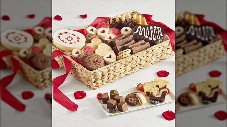 Harry and David Bakery Tray holding assorted cakes and cookies and a small dish of sweets nearby