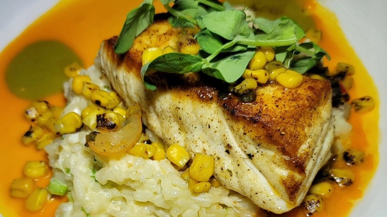 Fish dish with corn and garnishes