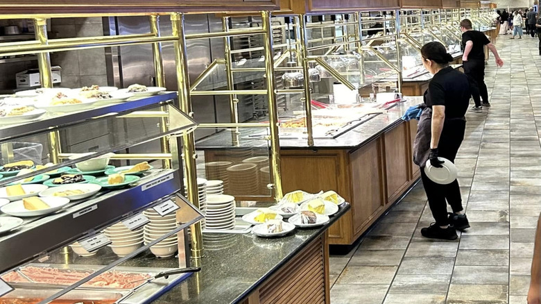 Numerous buffet lines with desserts and hot food trays