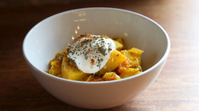 Bowl of potato and pea curry