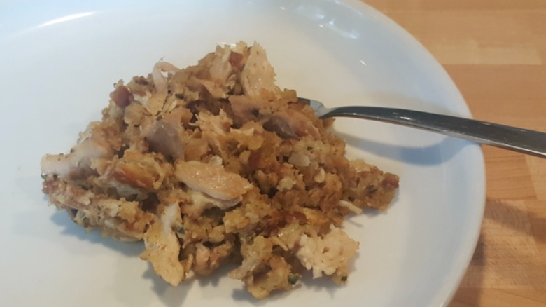 Garbage chicken on a plate with a fork