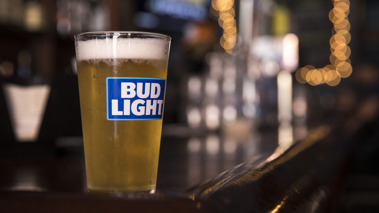 A pint of light adjunct lager on a bar