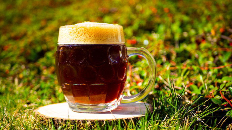 A mug of bock beer pictured outdoors