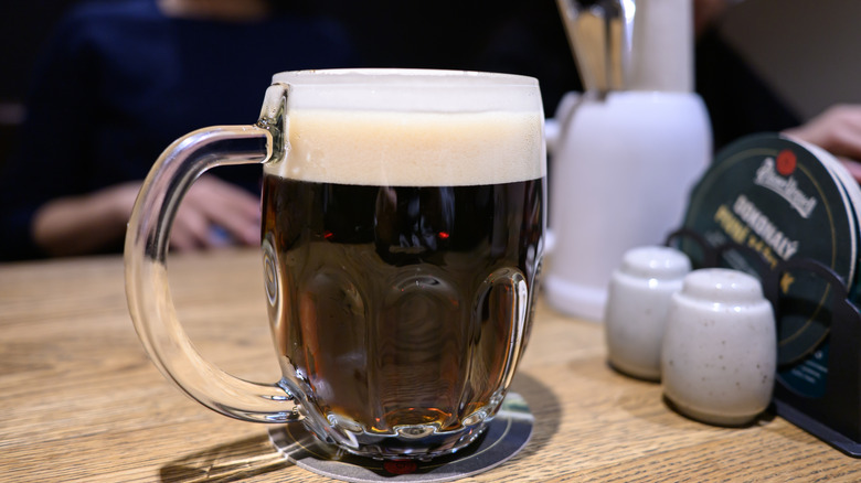 A mug of Czech dark lager on a table