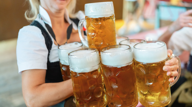 A waitress carries mugs of Marzen at Oktoberfest