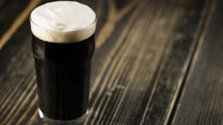 A glass of stout beer on a table