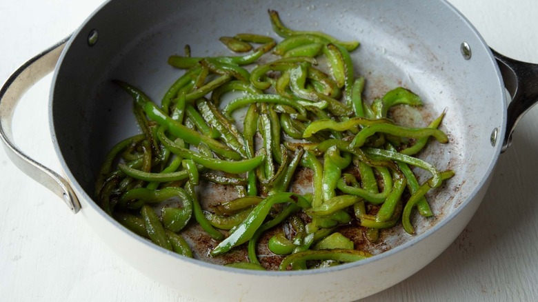 green peppers in a frying pan