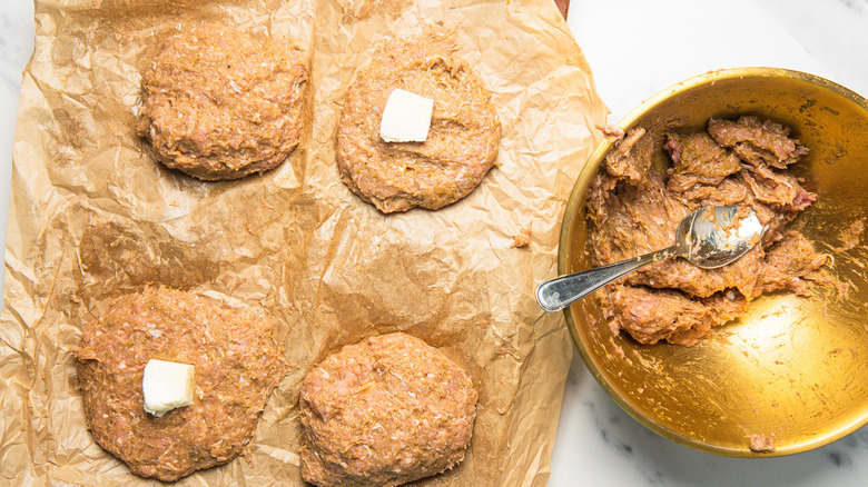 Turkey burgers with mozzarella cube in the center.