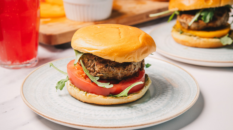 A pesto turkey burger on a plate.
