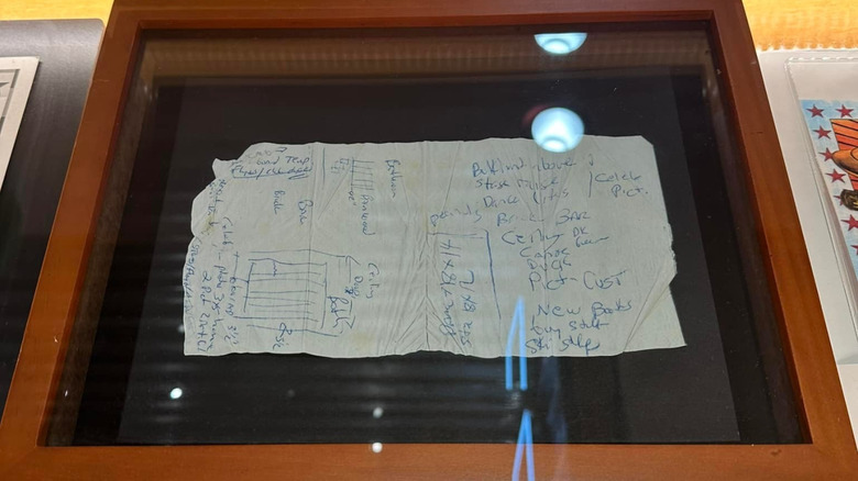 The original Texas Roadhouse napkin on display in a glass case