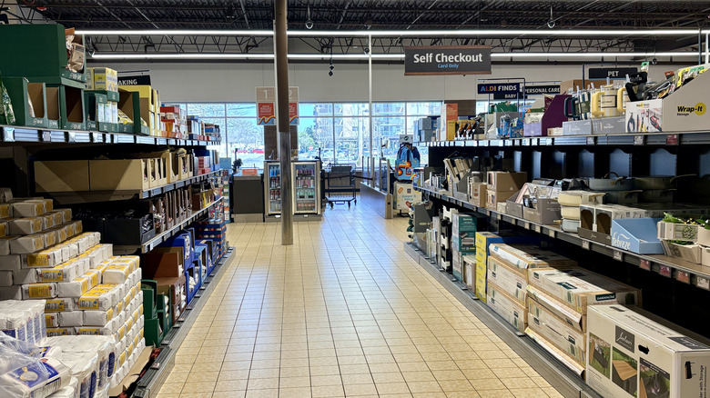 Aldi Aisle of Shame stocked with products food and non-food products near self checkout