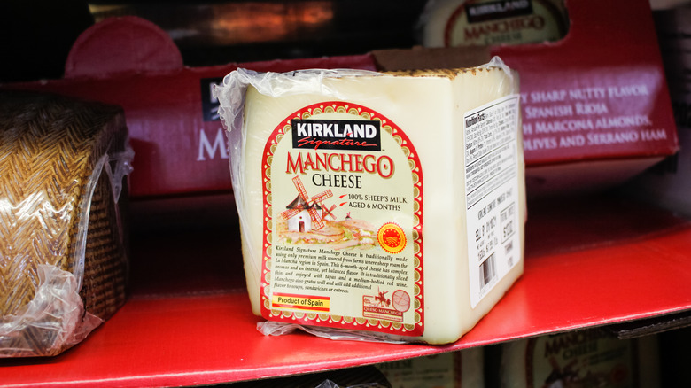 Kirkland Manchego sitting on a red grocery store shelf