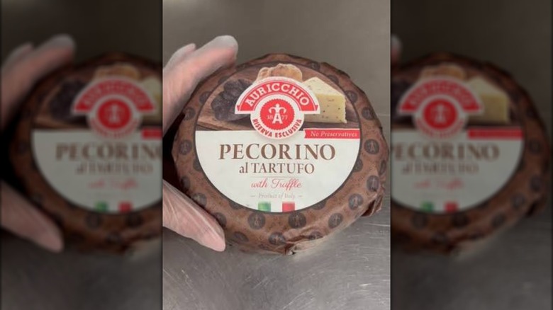 A wrapped up mini-wheel of Auricchio Pecorino al Tartufo truffle cheese