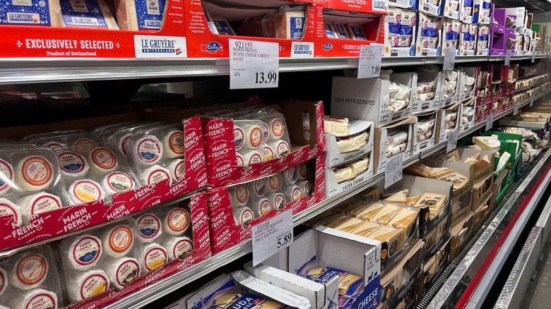 A variety of cheeses on display for sale at Costco.