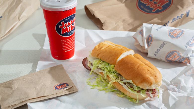 Jersey Mike's sandwich and drink on a table.