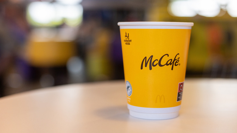 A McCafe hot drink cup on a table