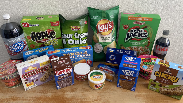 Each Dollar Tree dupe and its name-brand equivalent crammed onto a table